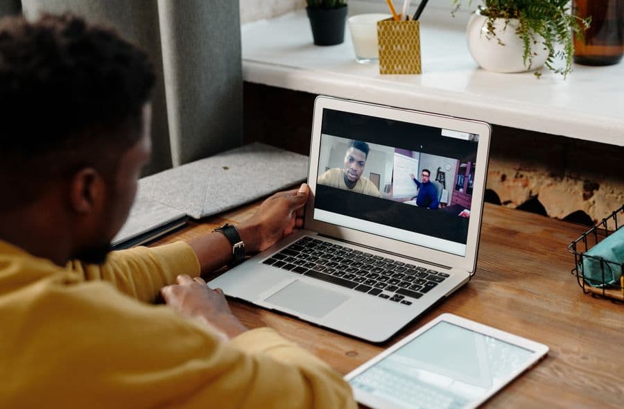 A learner connecting with an AI training counsellor over video